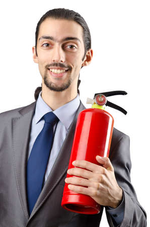 Man with fire extinguisher in firefighting conceptの写真素材