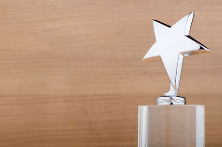 Star award against wooden backgroundの写真素材
