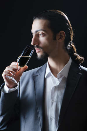 Man tasting wine in glassの写真素材