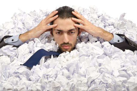 Man with lots of crumpled paper