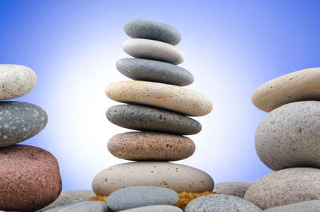 Balanced pebbles with colour background