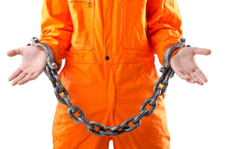 Criminal in orange robe in prisonの写真素材