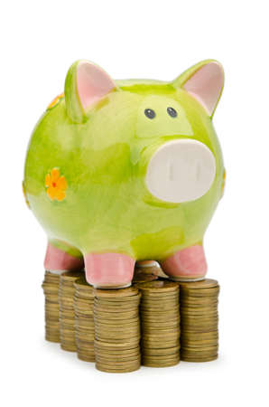Piggy bank and coins isolated on whiteの写真素材