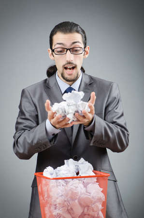 Man with lots of wasted paperの写真素材