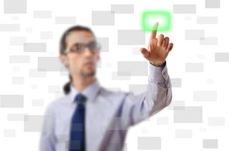 Businessman pressing virtual buttonsの写真素材
