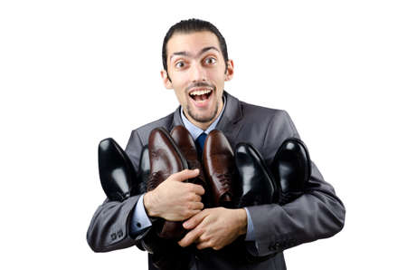 Man with a selection of shoesの写真素材