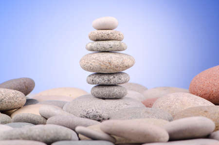 Pebbles stack against gradient backgroundの写真素材