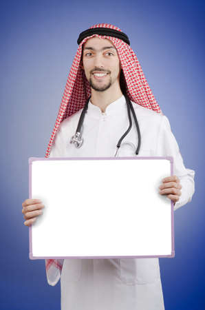 Arab with blank boardの写真素材