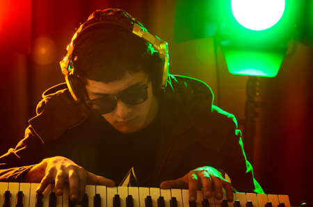 DJ mixing music at disco
