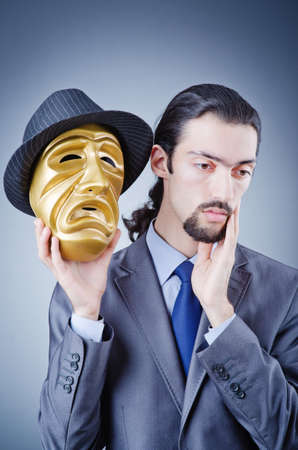 Businessman with mask concealing his identityの写真素材