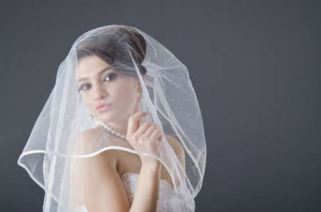 Bride in wedding dress in studio shooting