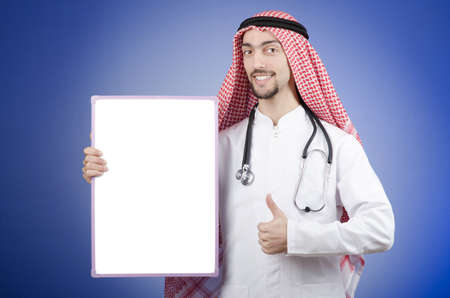Arab with blank boardの写真素材