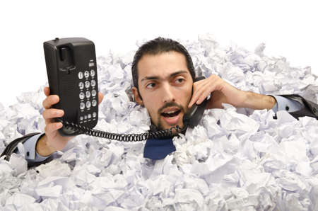 Man with lots of crumpled paper