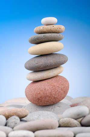 Pebbles stack against gradient backgroundの写真素材