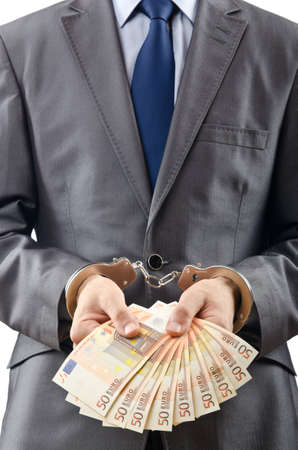 Handcuffed man with euro banknotes