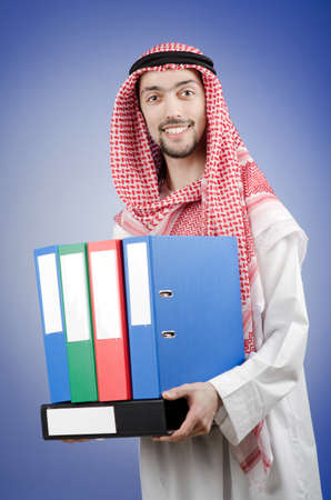 Arab businessman with office foldersの写真素材