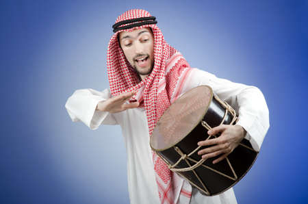 Arab playing drum in studio shootingの写真素材