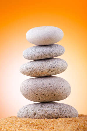 Balanced pebbles with colour backgroundの写真素材