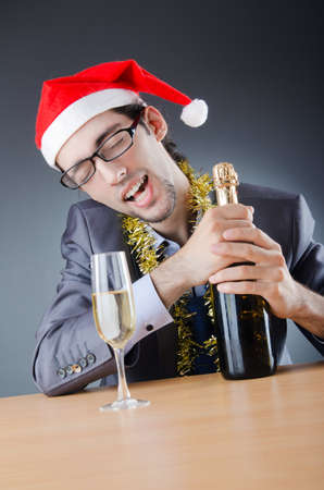 Drunken businessman after office christmas partyの写真素材