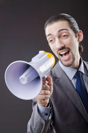 Man shouting and yelling with loudspeakerの写真素材