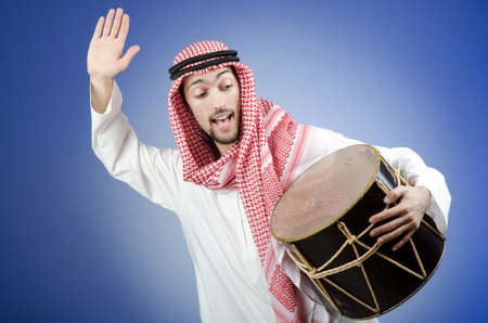 Arab playing drum in studio shootingの写真素材