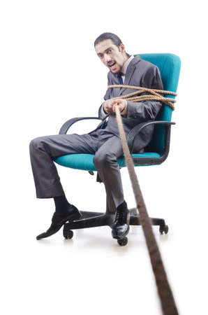 Businessman tied with ropeの写真素材