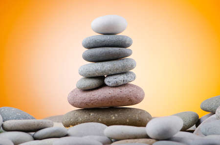 Balanced pebbles with colour backgroundの写真素材
