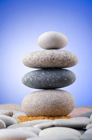 Balanced pebbles with colour backgroundの写真素材