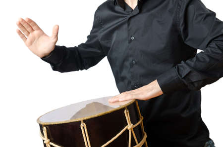 Drummer with drum playing on whiteの写真素材