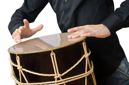 Drummer with drum playing on whiteの写真素材