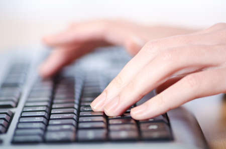 Hands typing on the keyboard