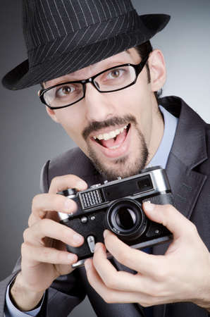 Photographer man with vintage cameraの写真素材