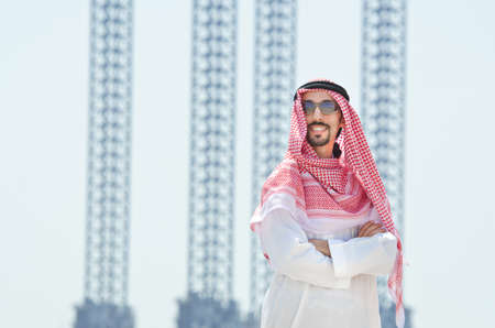 Arab on seaside in traditional clothingの写真素材