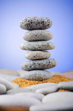 Balanced pebbles with colour background