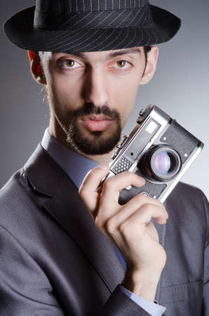Photographer man with vintage cameraの写真素材