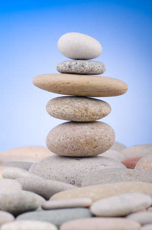 Pebbles stack against gradient backgroundの写真素材