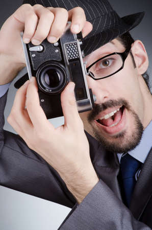 Photographer man with vintage cameraの写真素材