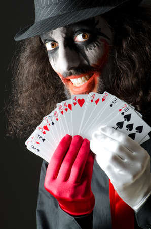 Joker with cards in studio shootの写真素材