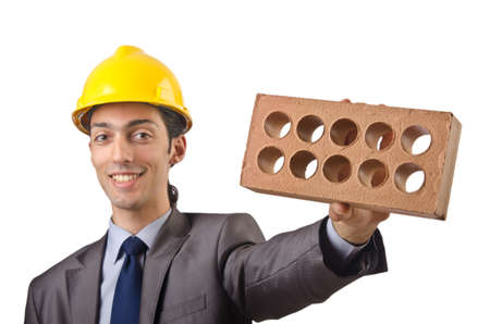 Businessman with bricks on whiteの写真素材