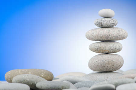 Pebbles stack against gradient backgroundの写真素材