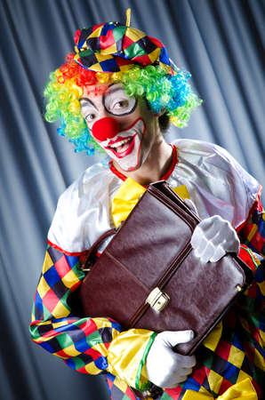 Clown with business briefcaseの写真素材