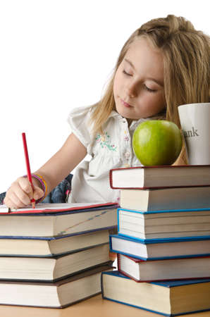 Little girl writing with pencilsの写真素材