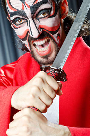 Man with face mask and swordの写真素材