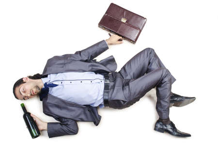Drunk businessman on the floorの写真素材