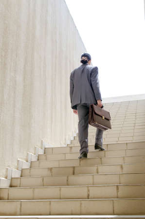 Businessman with stair in business conceptの写真素材