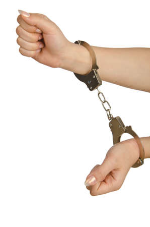 Handcuffed hands on white backgroundの写真素材