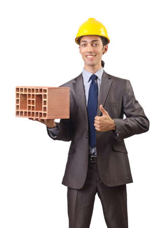 Businessman with bricks on whiteの写真素材