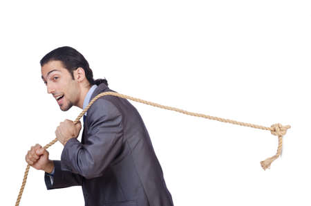 Businessman pulling rope on whiteの写真素材