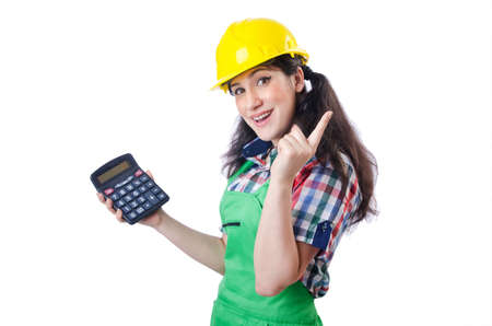 Woman builder with calculator on whiteの写真素材
