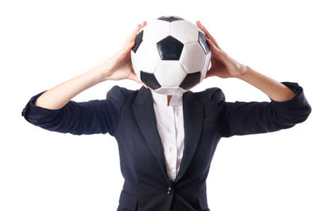 Businesswoman with football on whiteの写真素材